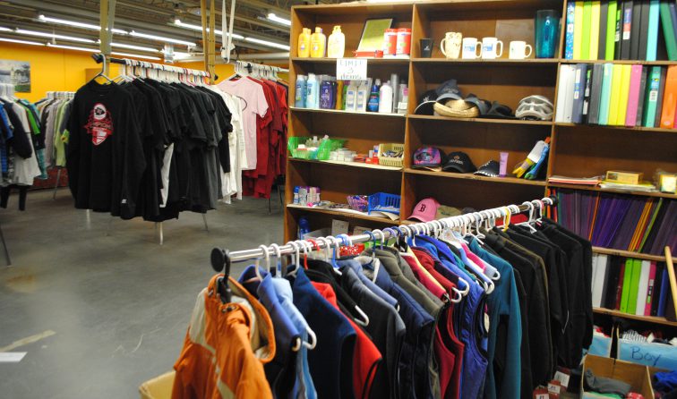 brightly colored clothing on racks in HOPE Boutique