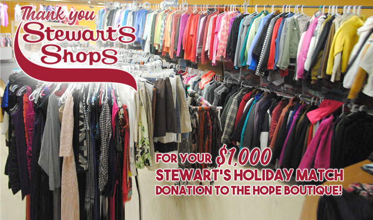 colorful clothing hanging neatly on racks with text - thank you Stewart's Shops for your $1,000 Holiday Match donation