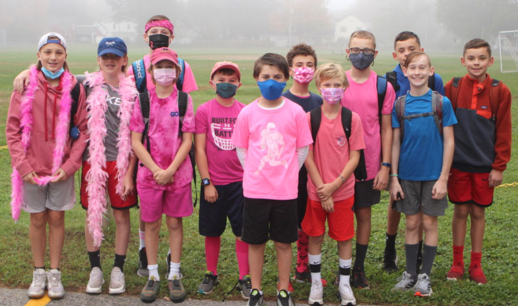 group of students dressed in pink for breast cancer awareness