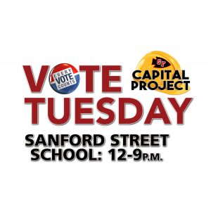 yellow construction hat with GF arrowhead and text Vote Tuesday Sanford Street School 12-9pm
