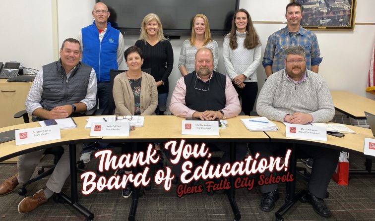 ALL 9 SCHOOL BOARD MEMBERS POSING FOR A GROUP PICTURE AT A RECENT MEETING