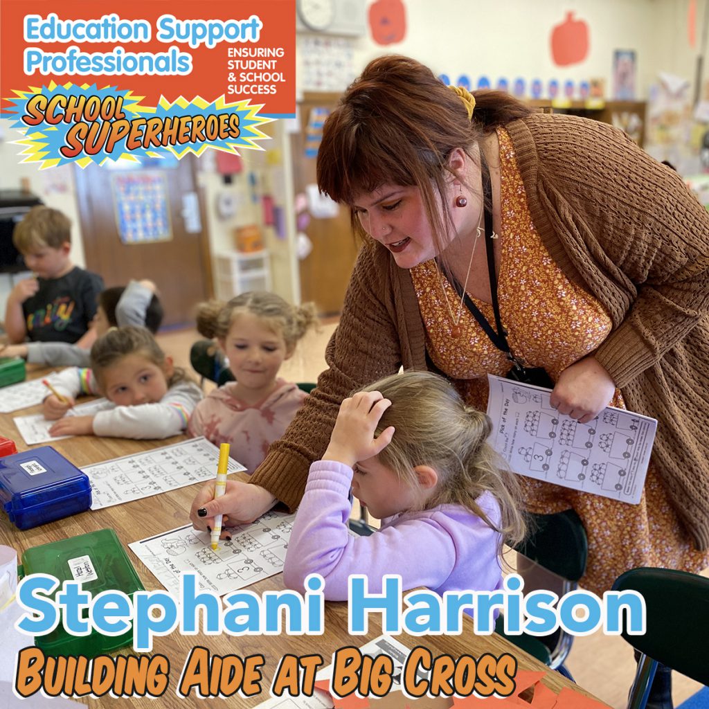 teacher aide helping students with a project and text: Education Support Professionals School SUperheroes Stephani Harrison, Building Aide at Big Cross