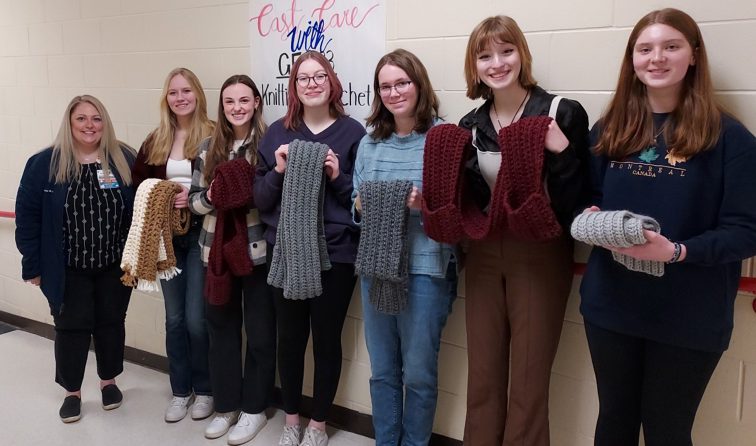 Students with Cast With Care deliver handmade scarves and shawls to Glens Falls Hospital