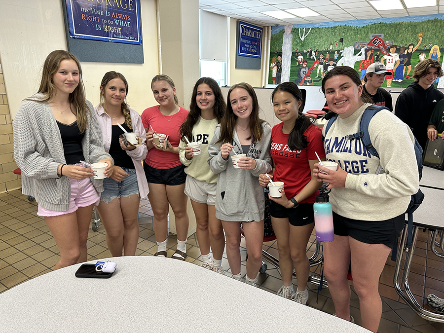 students enjoying ice cream together in cafeteria