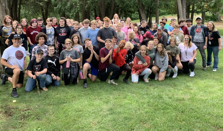large group of students in Crandall Park after completing a community service project to clean up