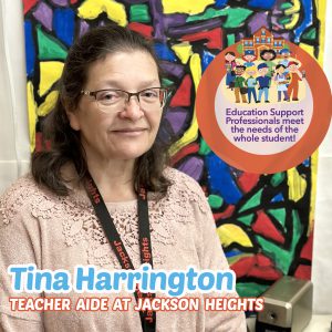Woman in front of a colorful elementary art painting, smiling with the Education Support Professionals logo in the corner